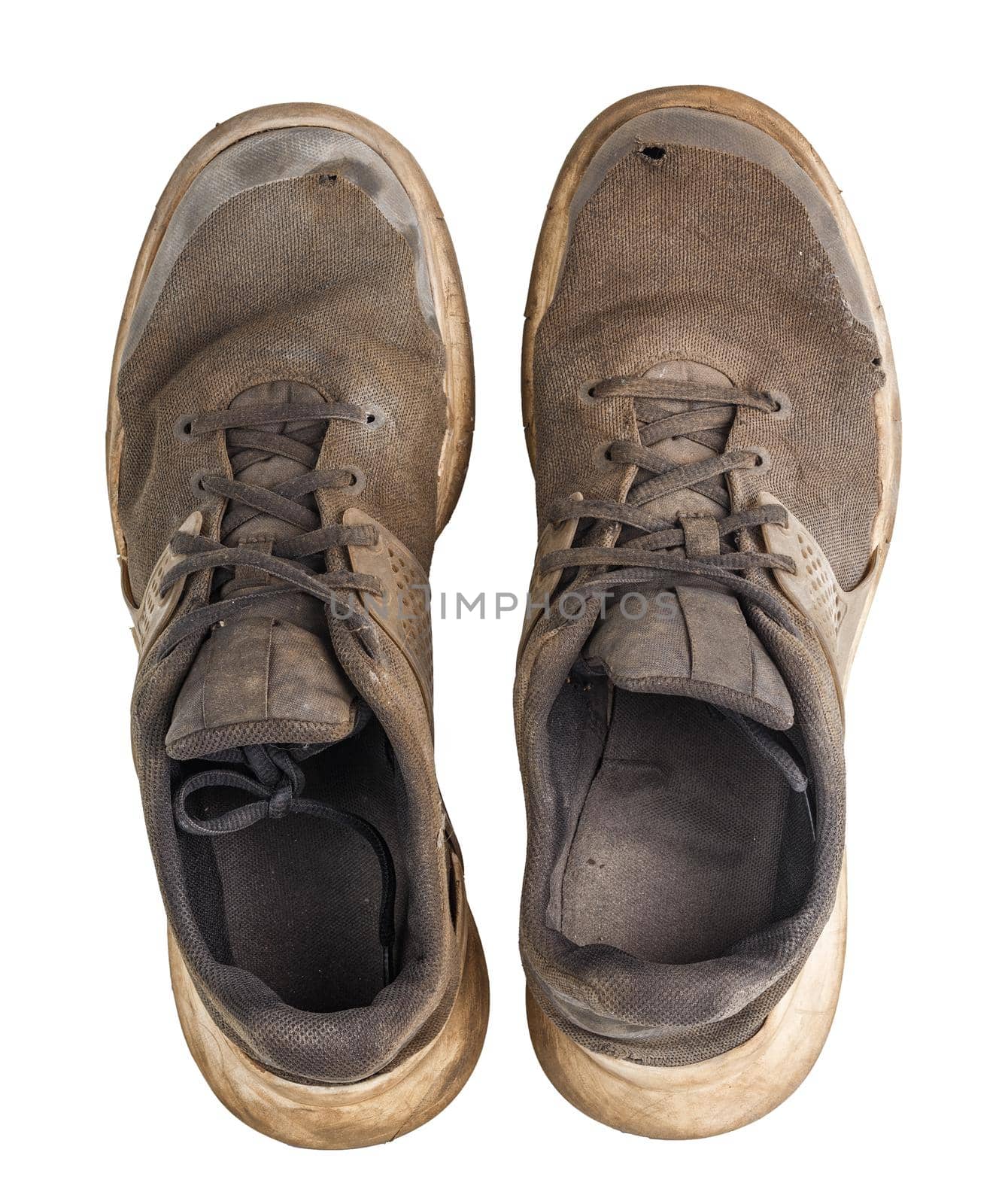a pair of weared dirty sneakers isolated on white background, flat lay vew from above by z1b