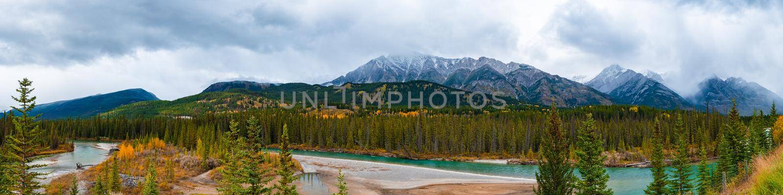 Canadian rockies in Canada with blue green river Bow valley under the surveillance of mighty Rocky Mountains by fokkebok