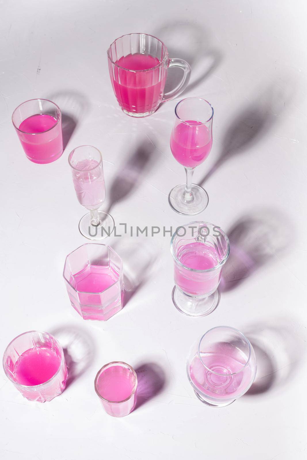 Set of glasses with rose water on a white background by sashokddt