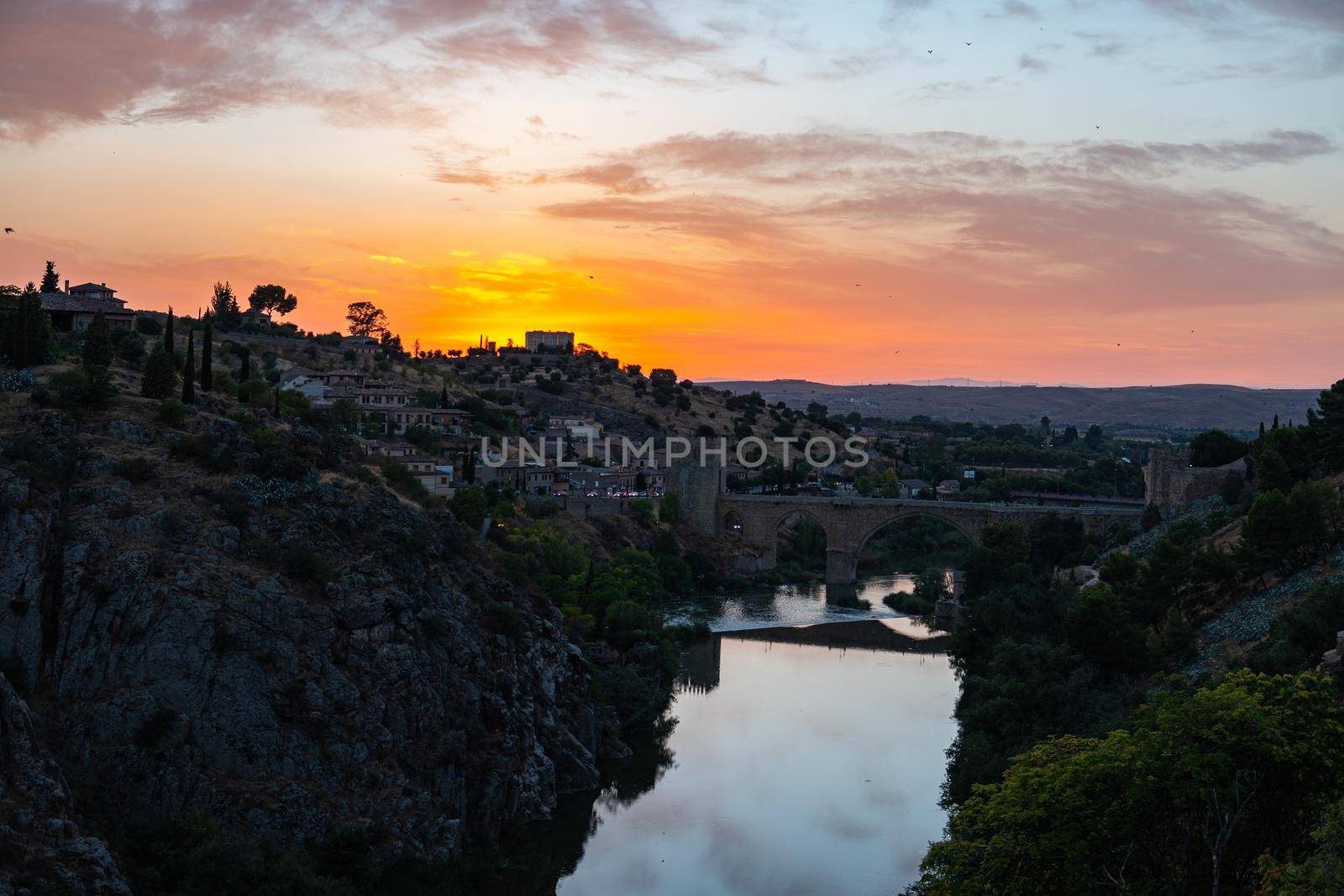 Sunset in Toledo by the river with a cloudy