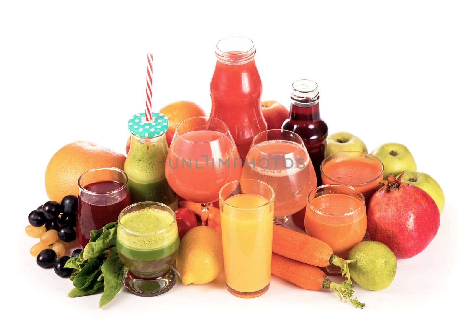 Glasses with fresh organic vegetable and fruit juices isolated on white. by aprilphoto