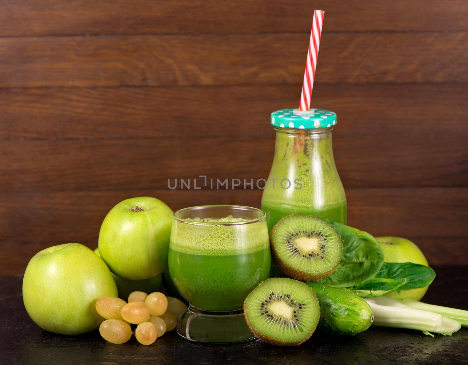 Healthy green smoothie with spinach in a jar mug isolated by aprilphoto