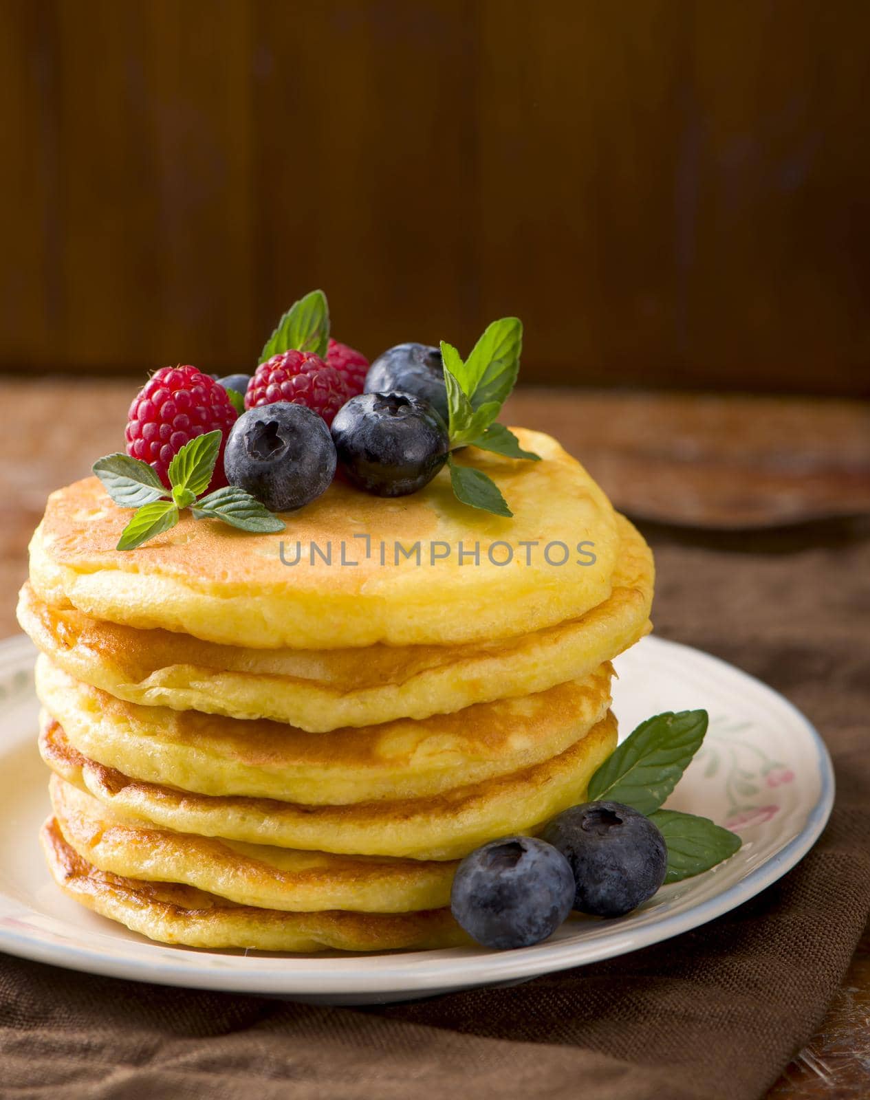 Stack of pancakes with fresh berries, close-up