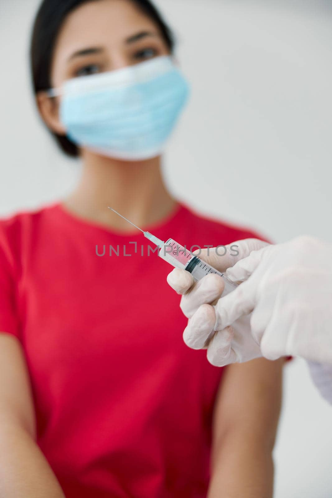 female patient wearing medical mask vaccination close-up by SHOTPRIME