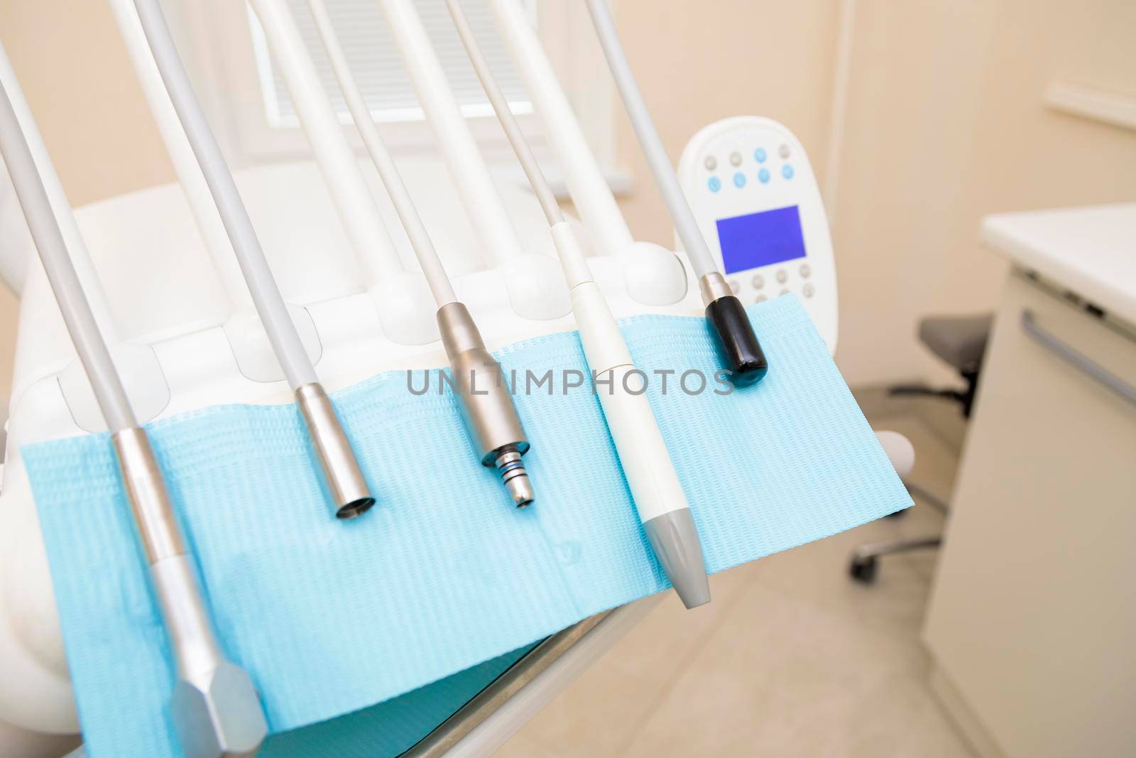 Interior of the dental office with a chair and tools for dental treatment.