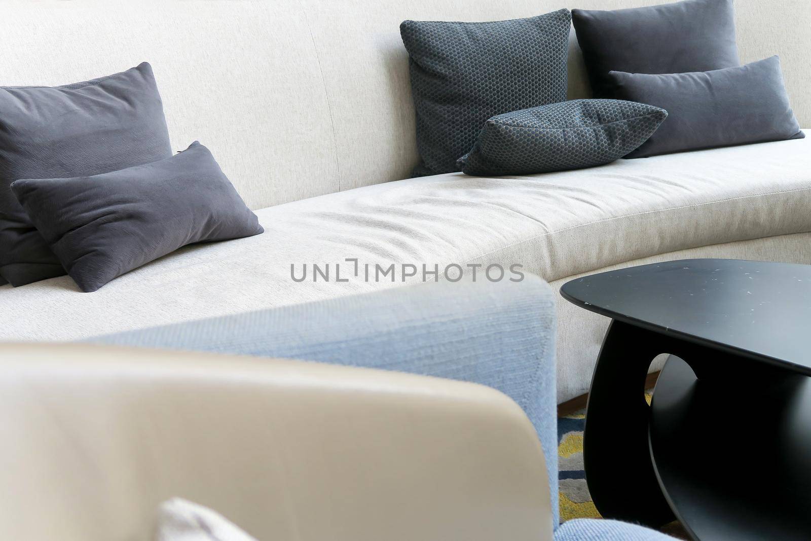 Detail image of cushion on sofa, modern living room.