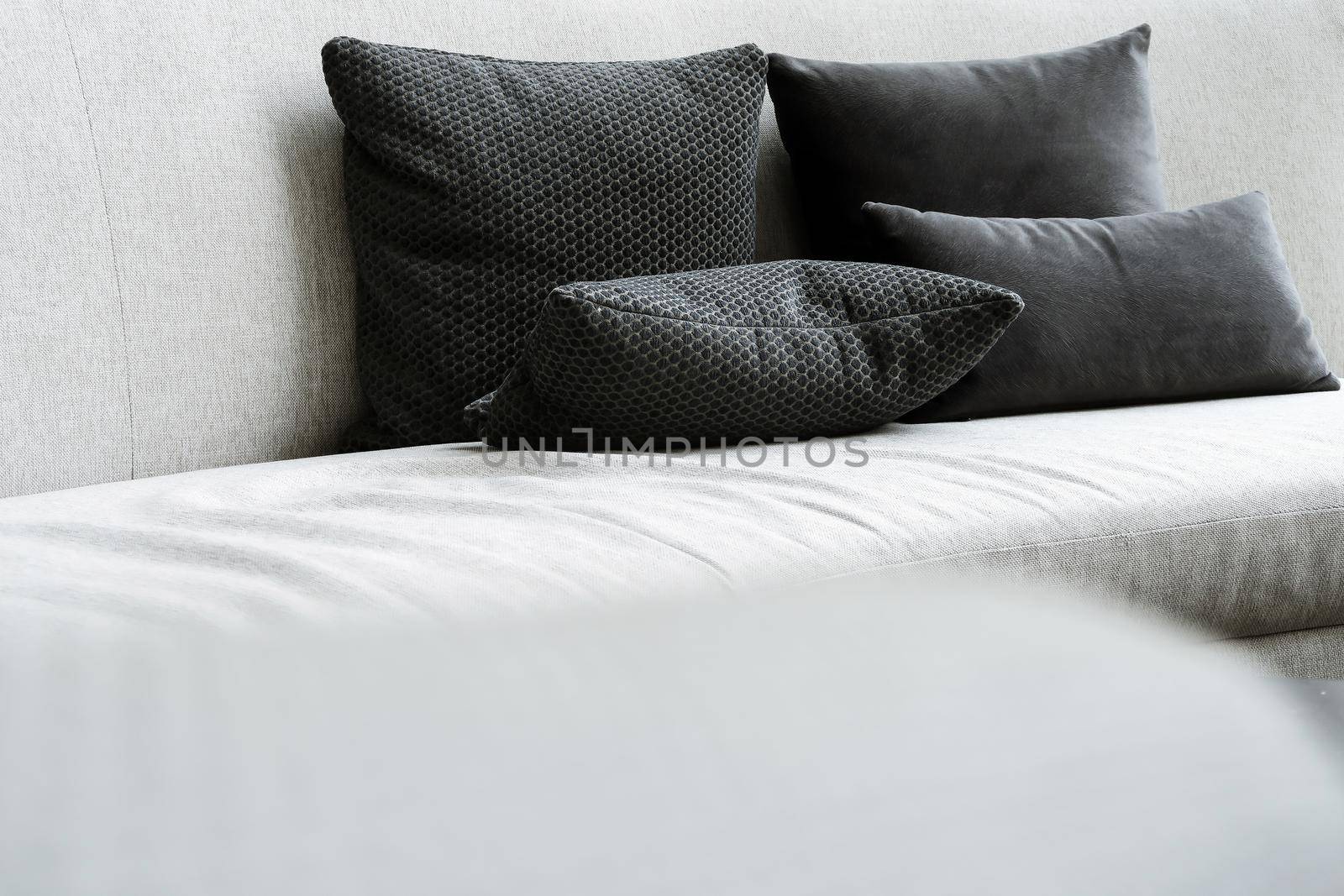 Detail image of cushion on sofa, modern living room.