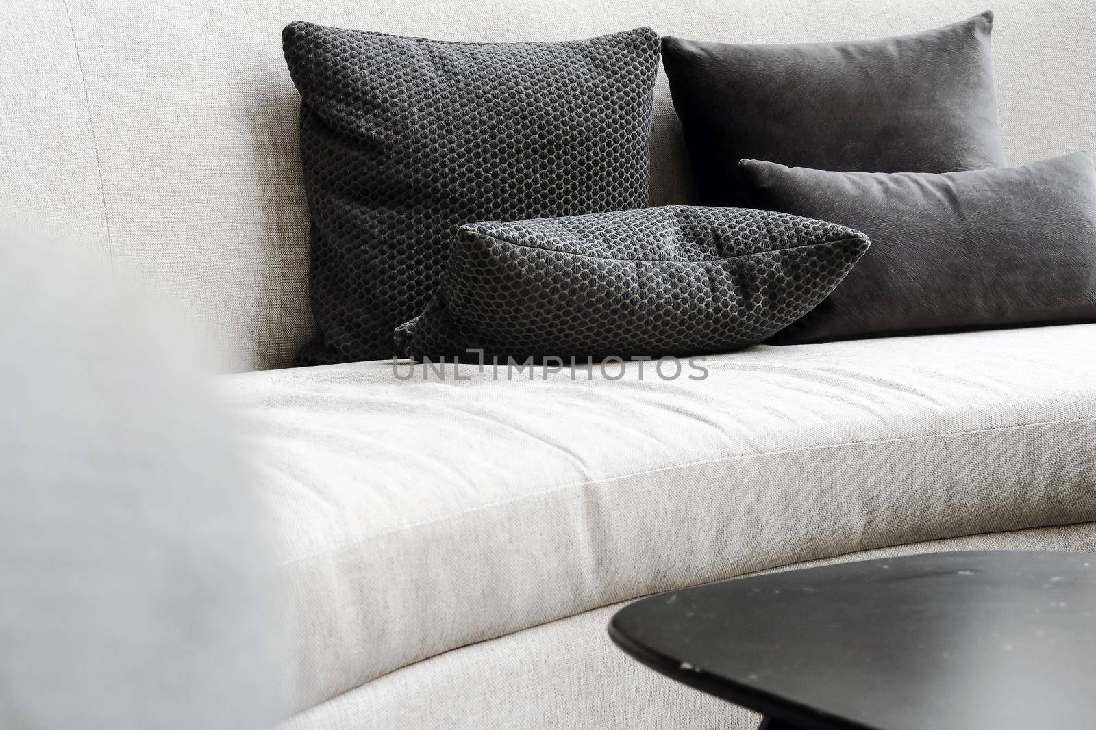 Detail image of cushion on sofa, modern living room.