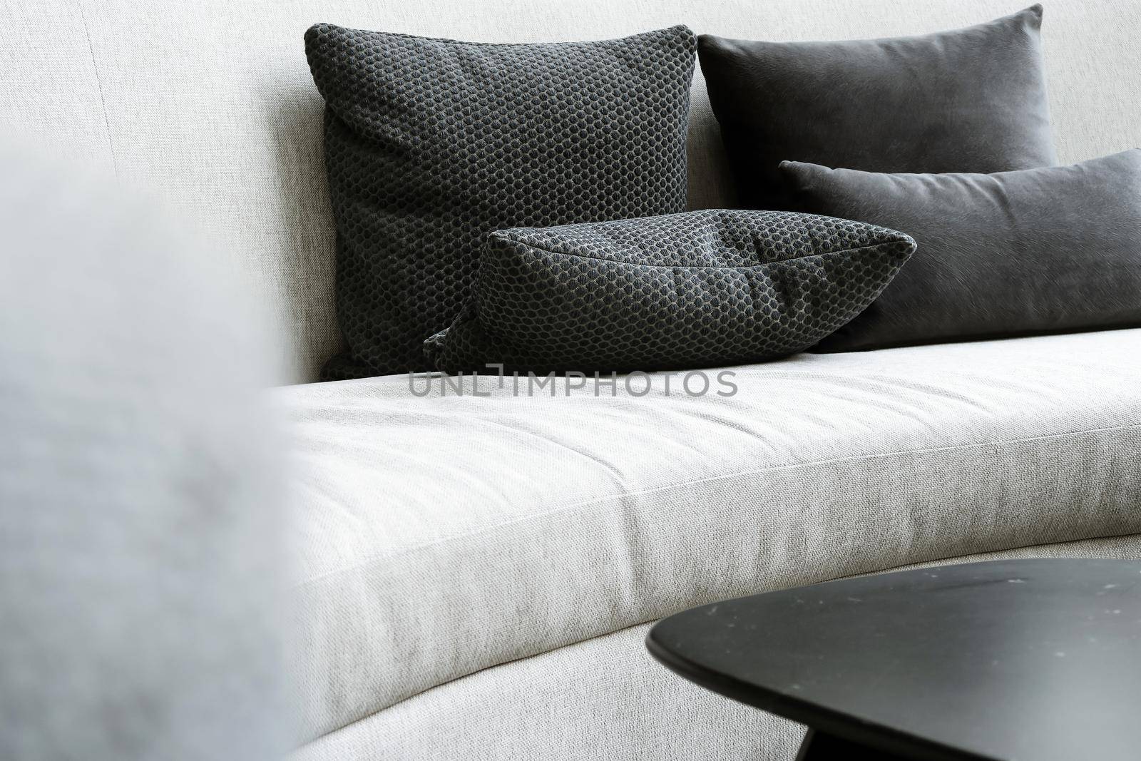 Detail image of cushion on sofa, modern living room.