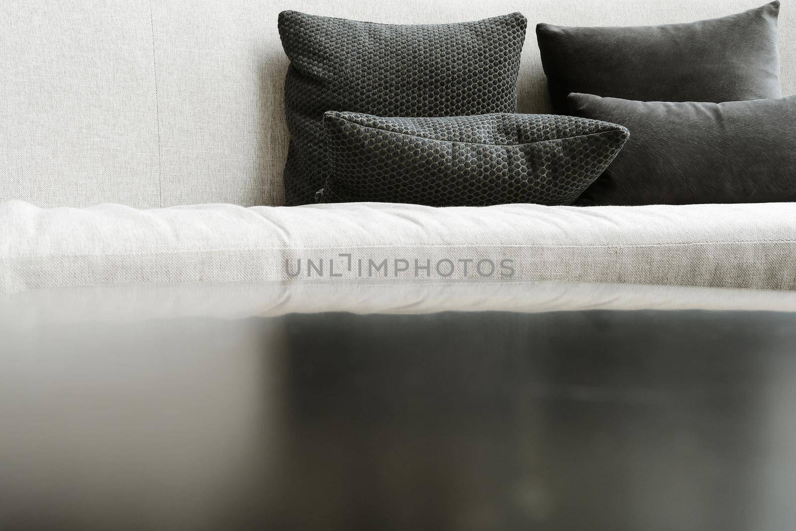 Detail image of cushion on sofa, modern living room.