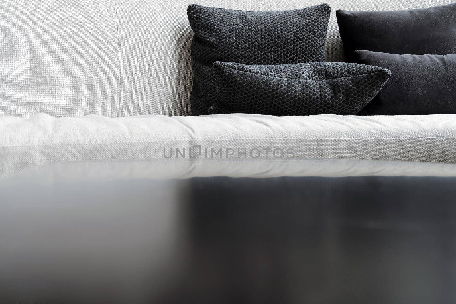 Detail image of cushion on sofa, modern living room.