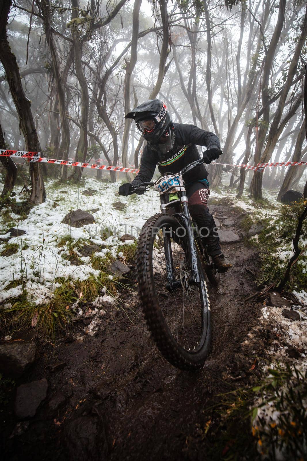 Mt Buller, Australia - January 16 2021: Practice round for the Victorian Downhill Mountain Bike Series after a summer snow storm