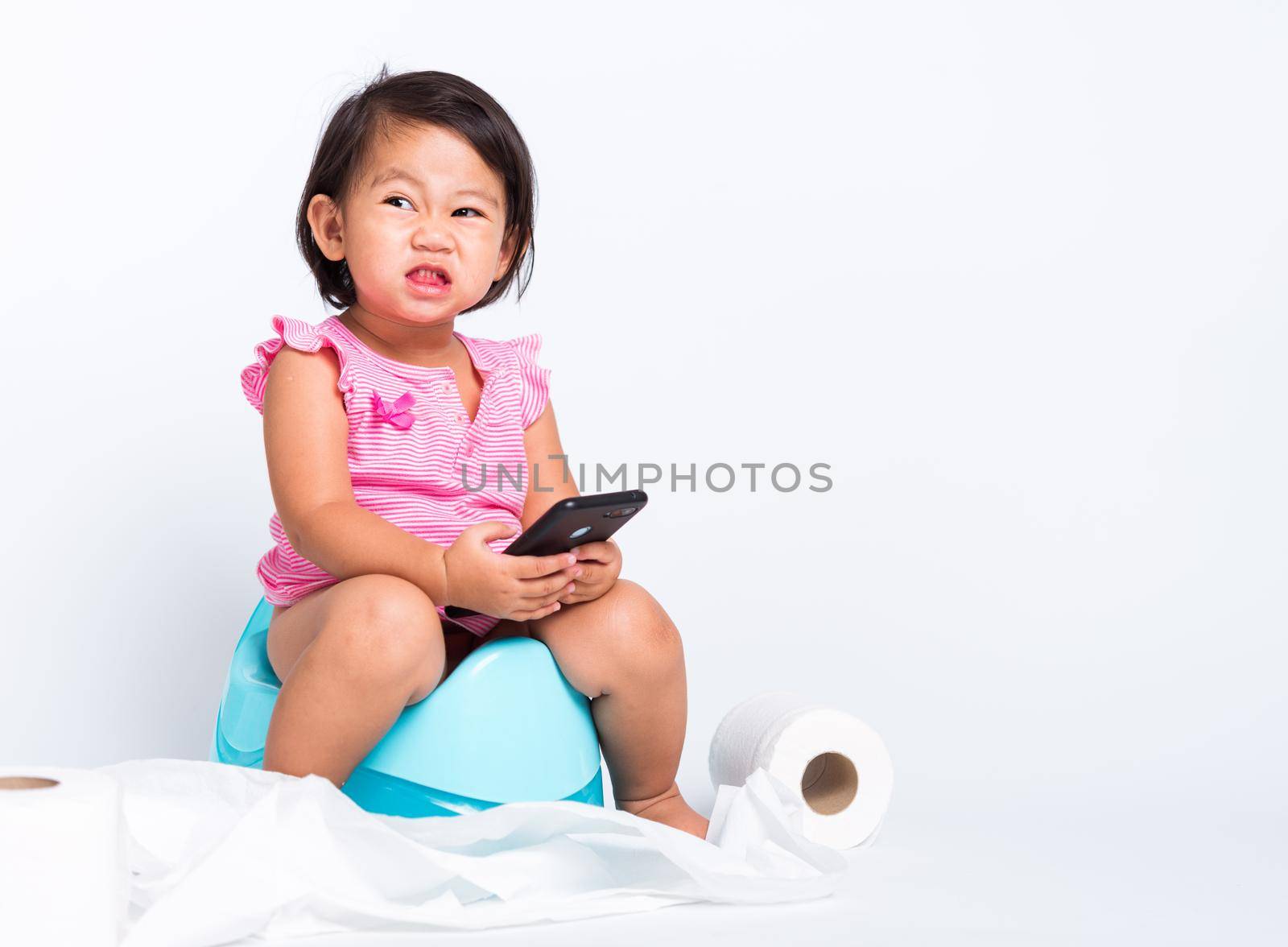 cute baby child girl education training to sitting on blue chamber pot by Sorapop