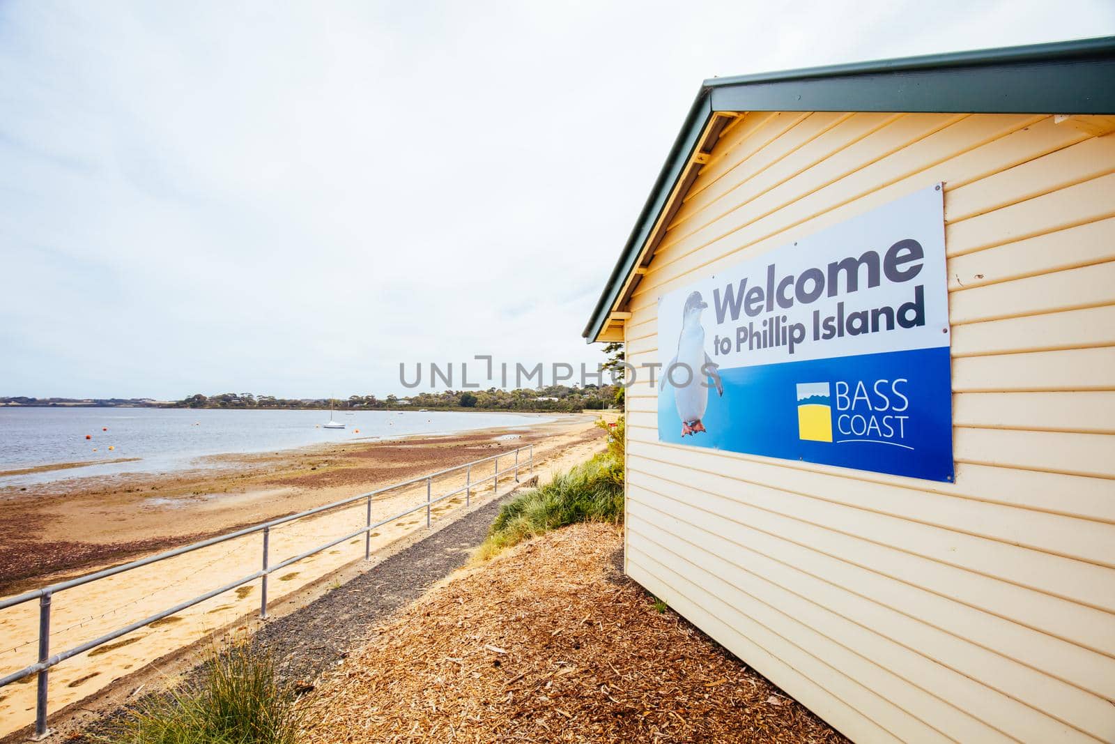 Rhyll, Australia - December 13 2020: The quaint seaside fishing town of Rhyll with main beach and jetty in Victoria, Australia