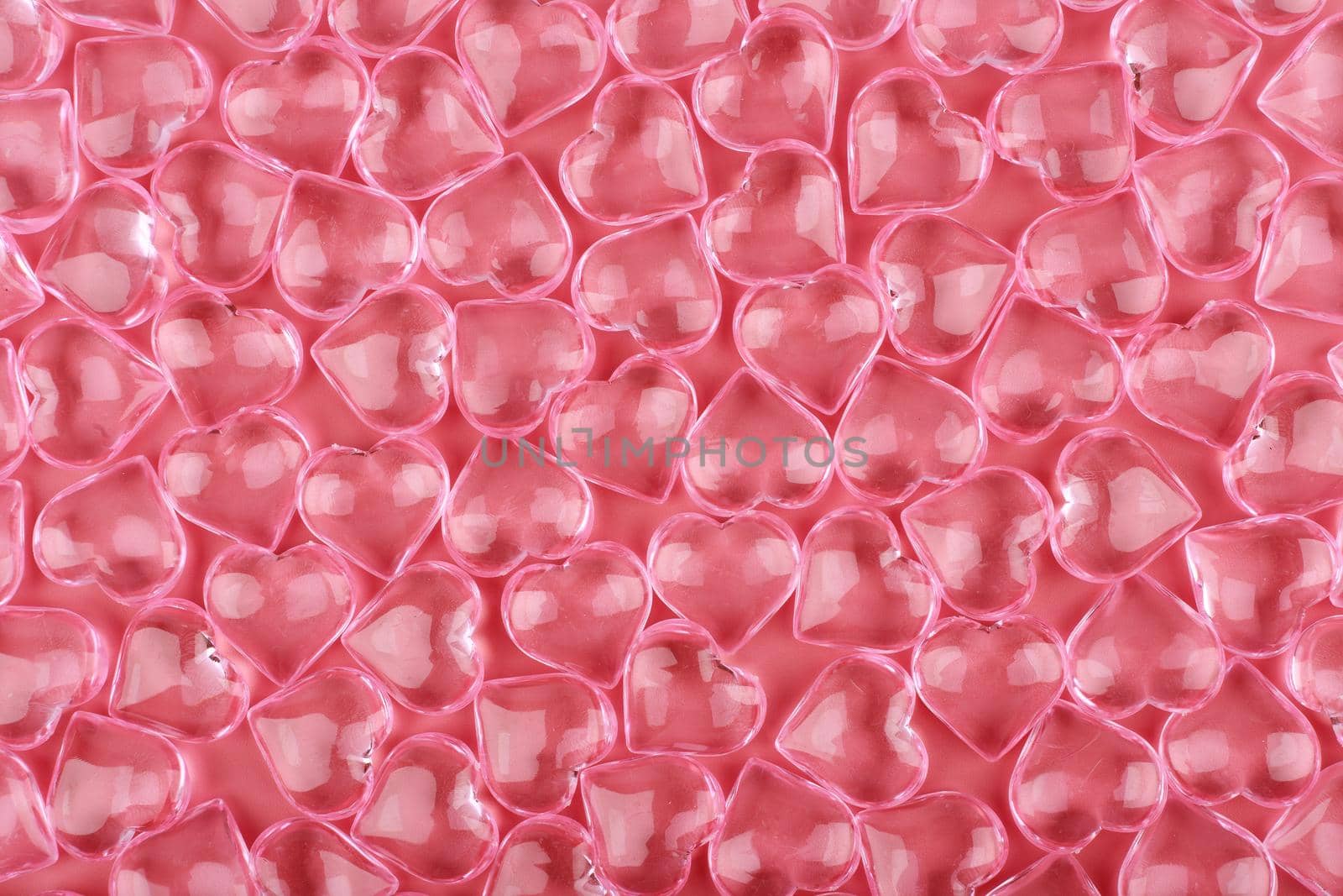 Pattern with transparent glass hearts against pink background. Concept of love and St. Valentine's day  by Senorina_Irina