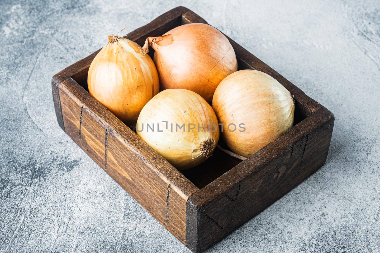 Organic onions, on gray background