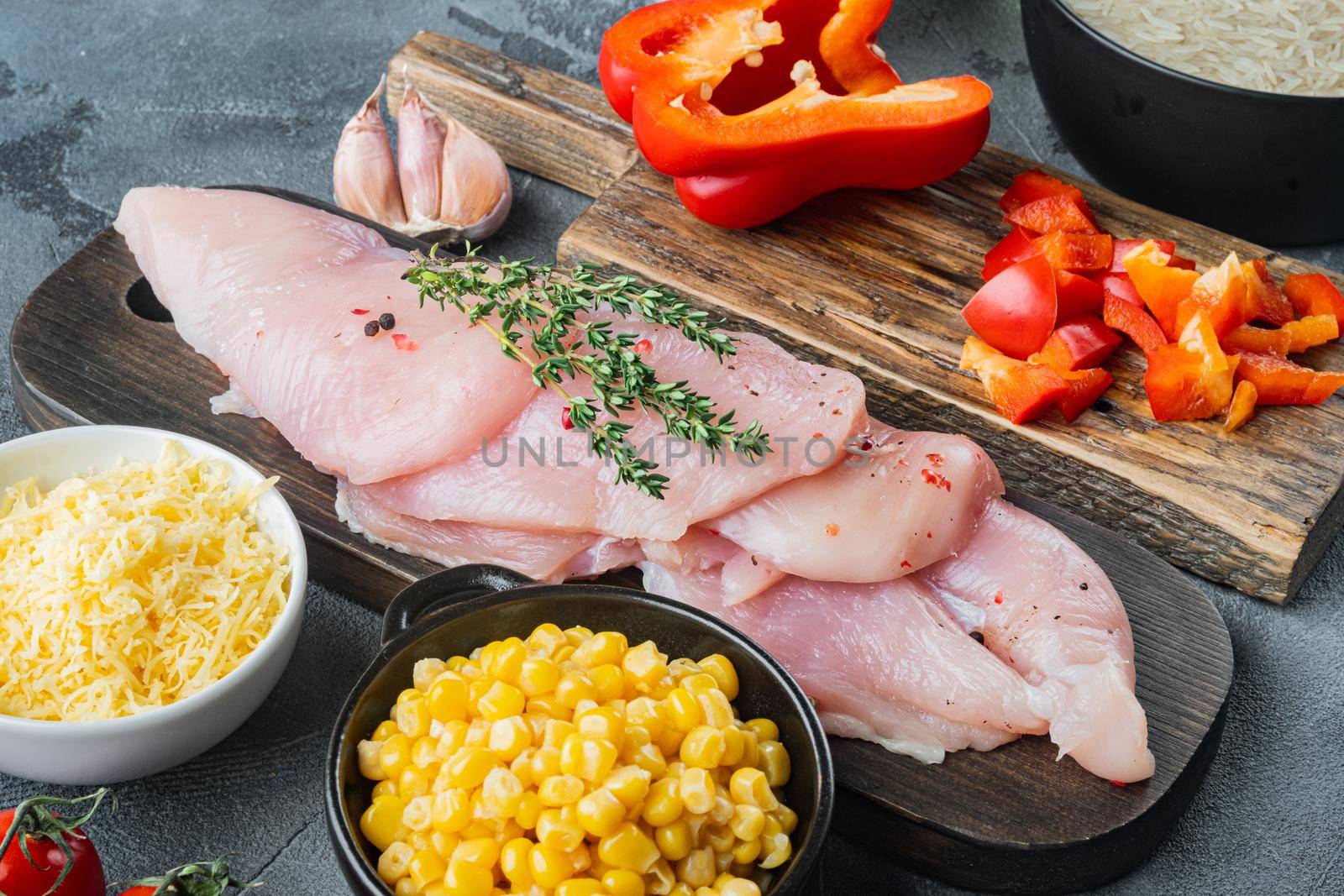 Mexican food ingredients Chicken Enchilada, Rice Casserole, on gray background
