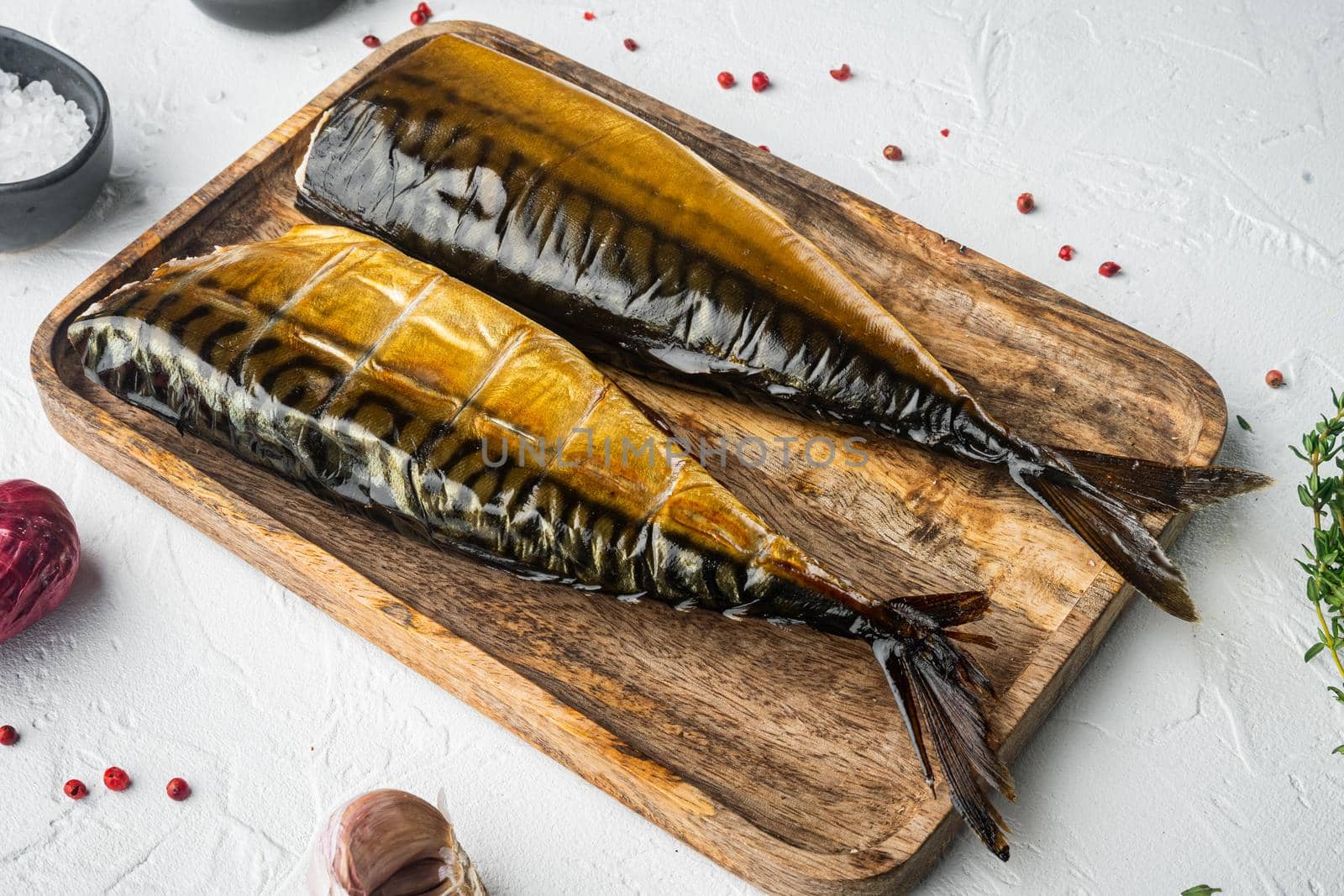 Whole smoked fish mackerel, on white background