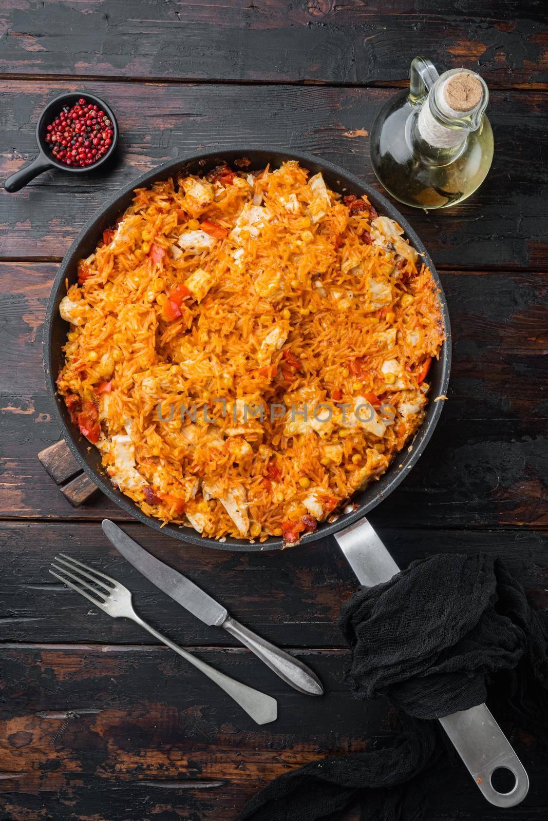 Traditional mexican enchiladas with chicken meat rice and cheese Mexican cuisine., on old dark wooden table background, top view flat lay