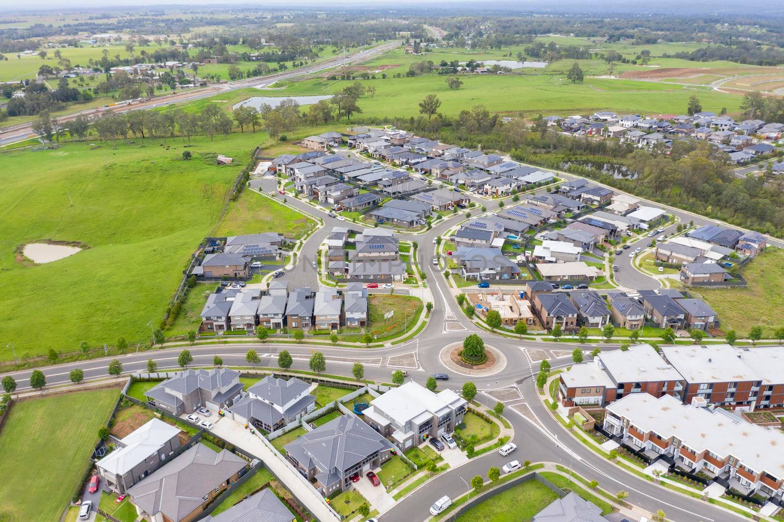 Aerial view of grey roofed houses in the suburbs by WittkePhotos