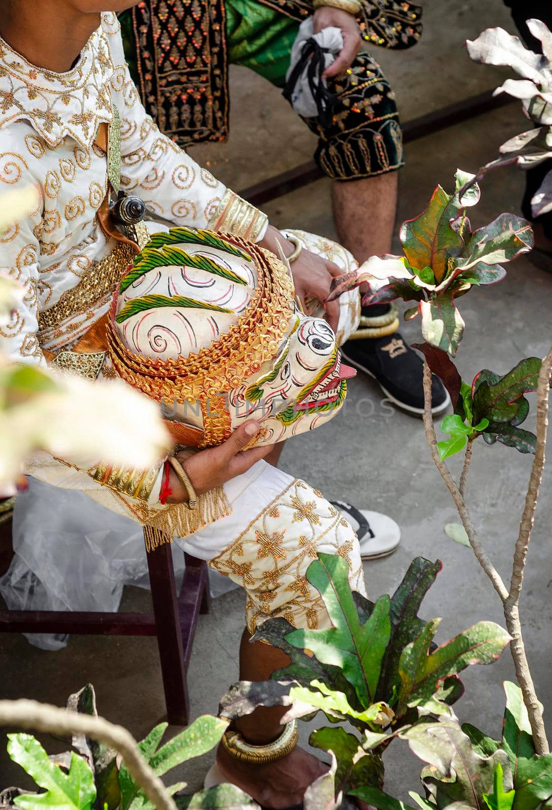 performer with traditional Lakhon Khol mask dance ceremony costume at Wat Svay Andet UNESCO Intangible Cultural Heritage site in Kandal province Cambodia