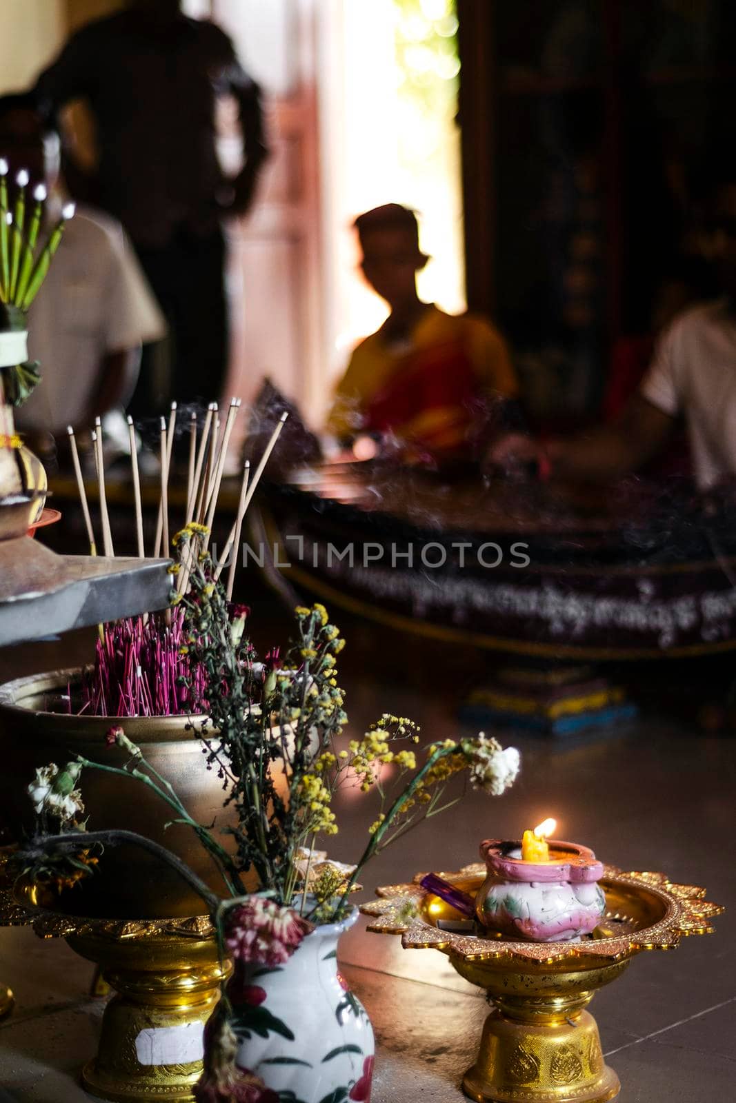 interior shrine detail in buddhist ceremony at temple in cambodia by jackmalipan