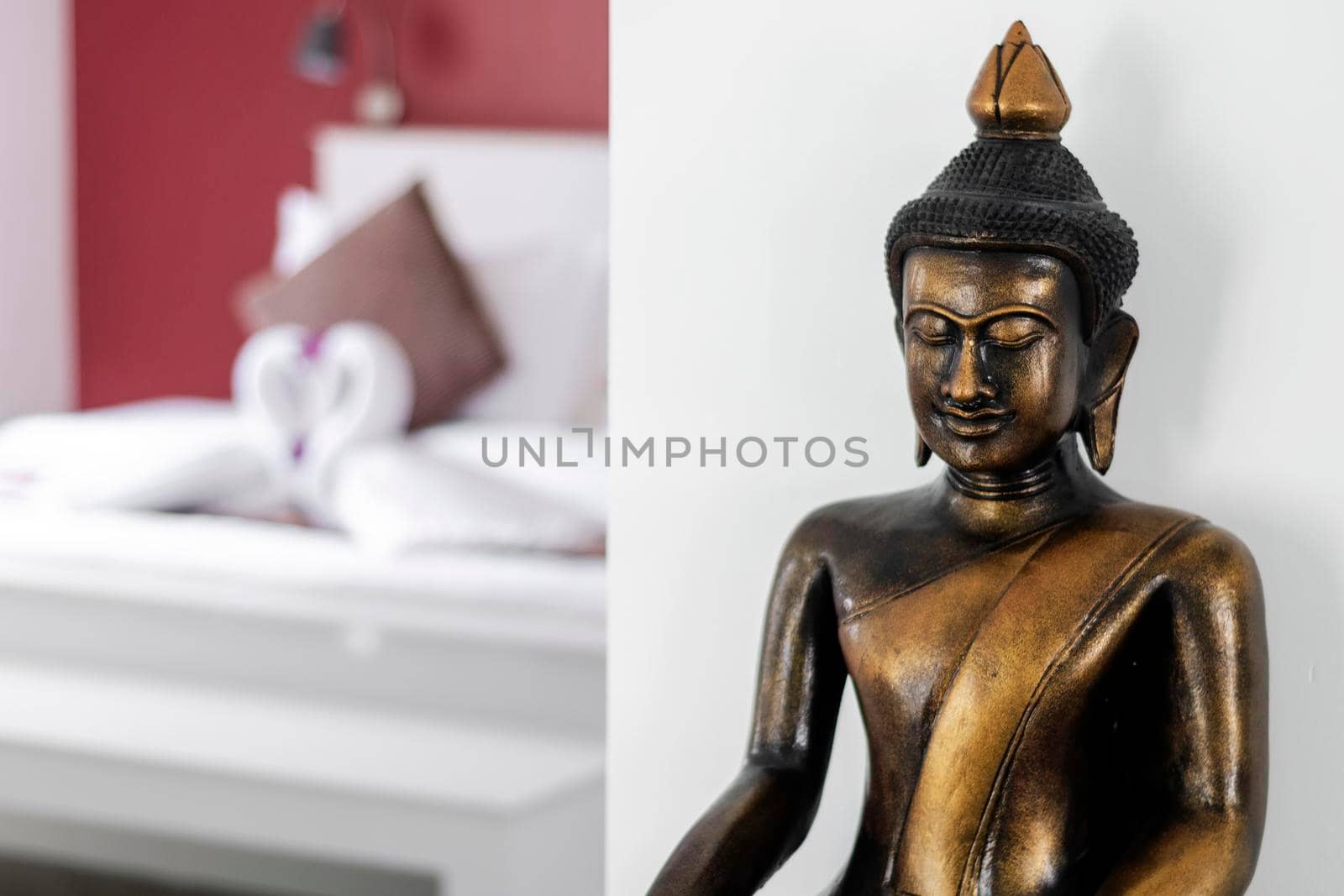bronze buddha statue interior design detail in modern asian home by jackmalipan