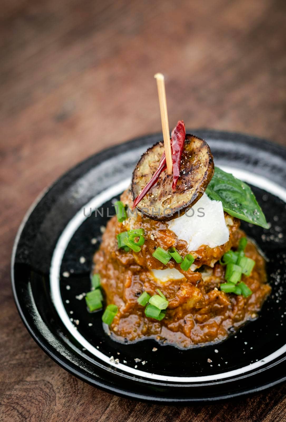 vegan quinoa cakes with sicilian roasted eggplant and spicy red pepper sauce gourmet tapas appetizer snack