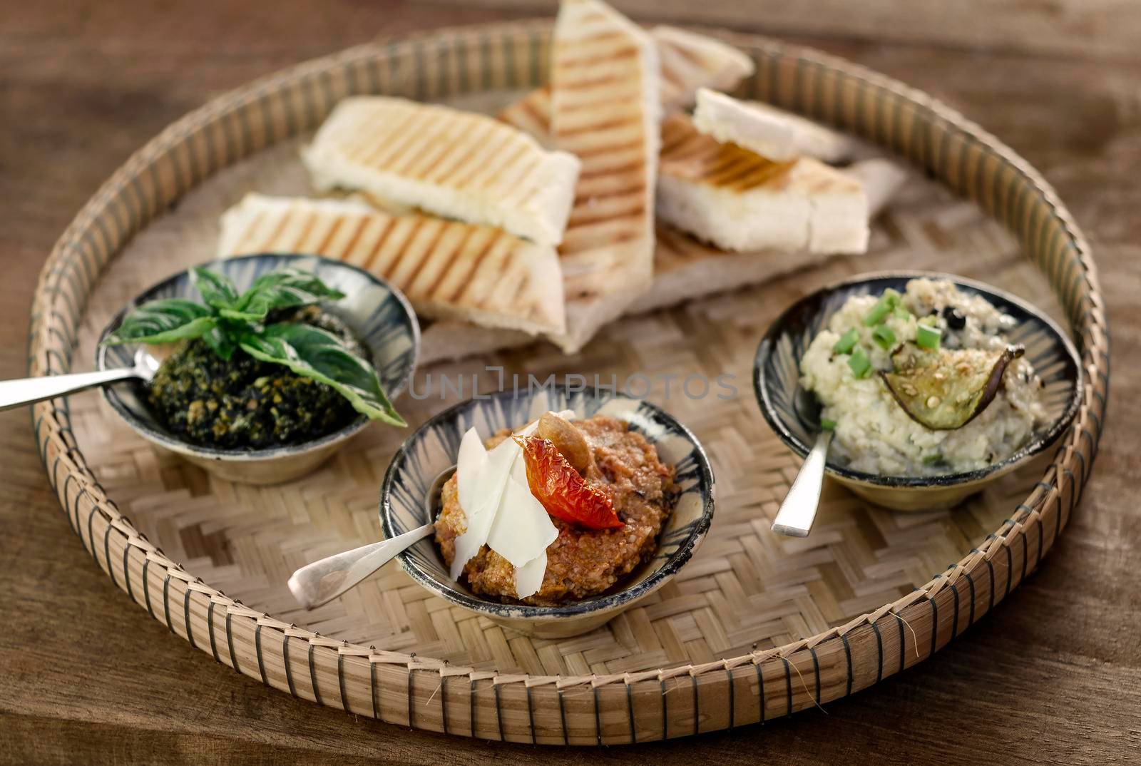 turkish meze vegetarian tapas snack platter on rustic wood table by jackmalipan