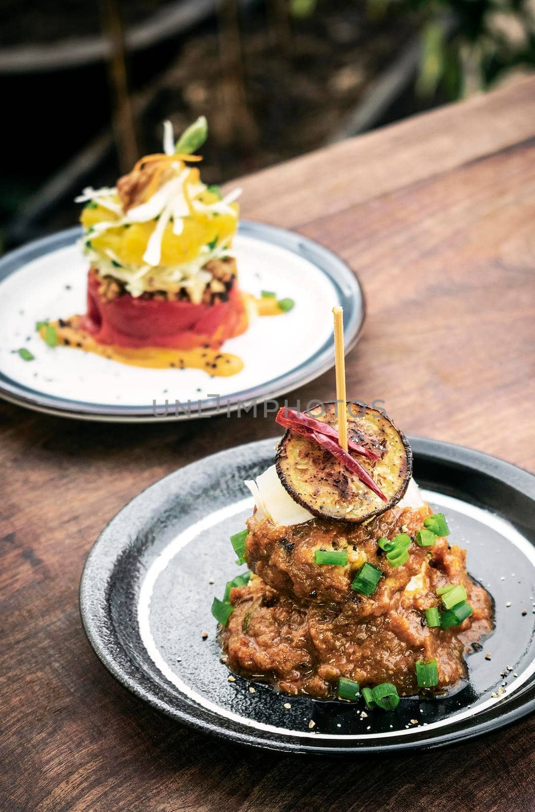 vegan quinoa cakes with sicilian roasted eggplant and spicy red pepper sauce gourmet tapas appetizer snack