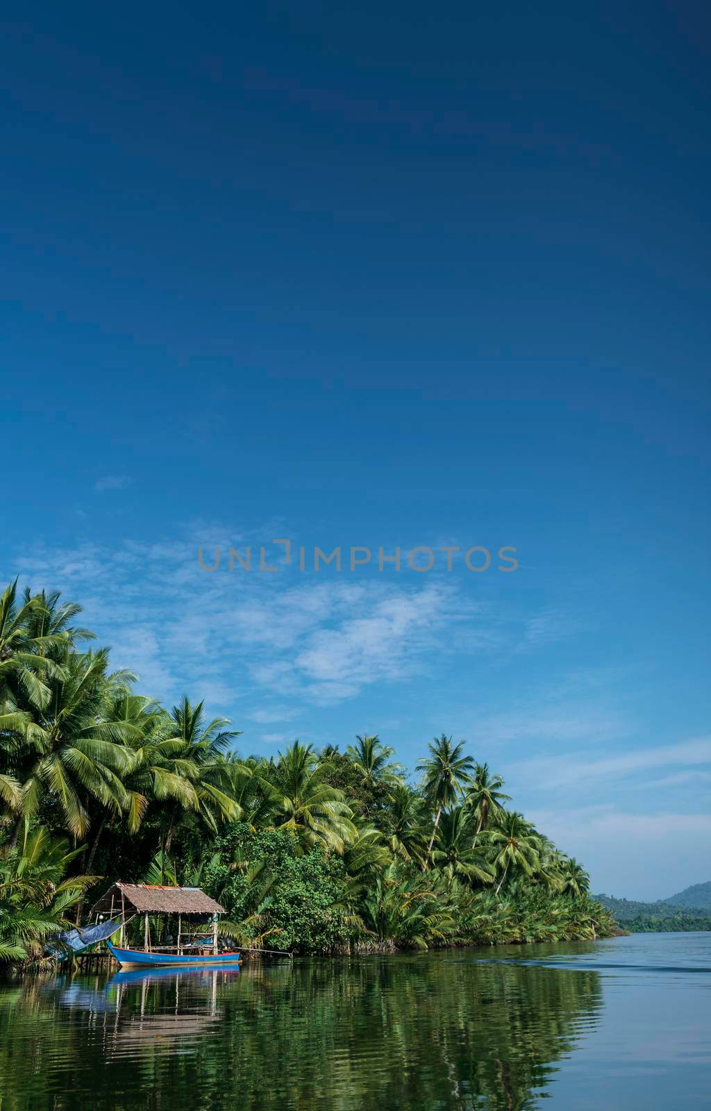 traditional boat and jungle hut on the tatai river in the cardamom mountains of cambodia