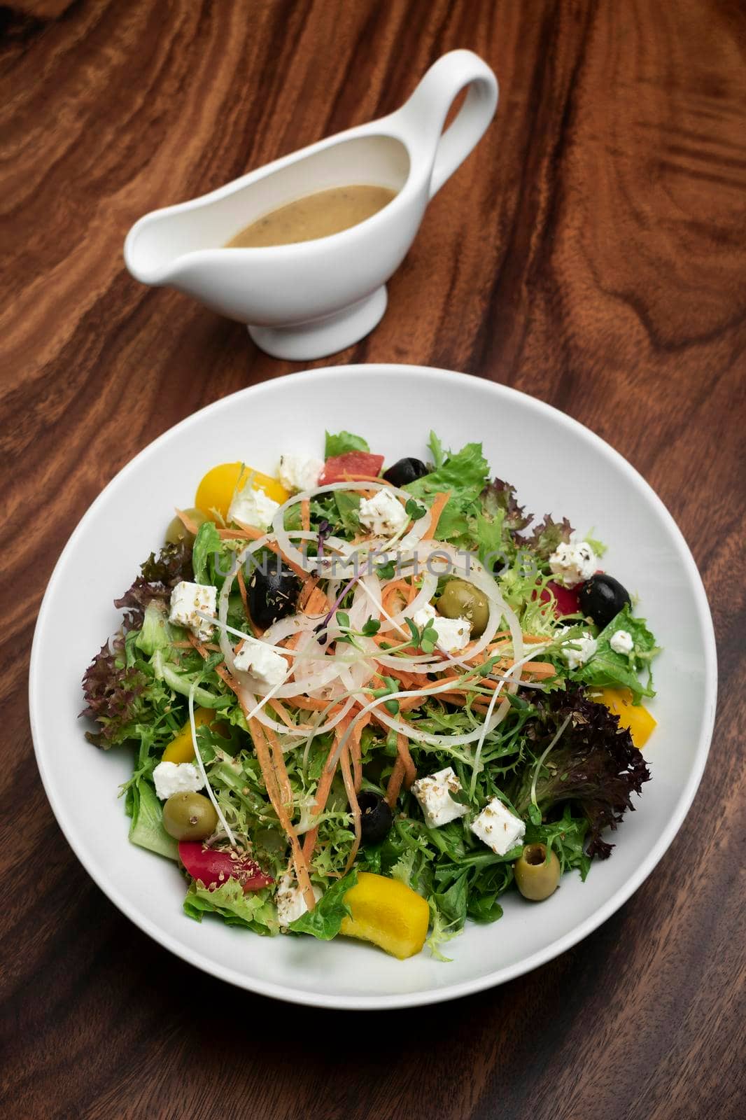 greek salad with feta cheese and olives with citrus vinaigrette by jackmalipan