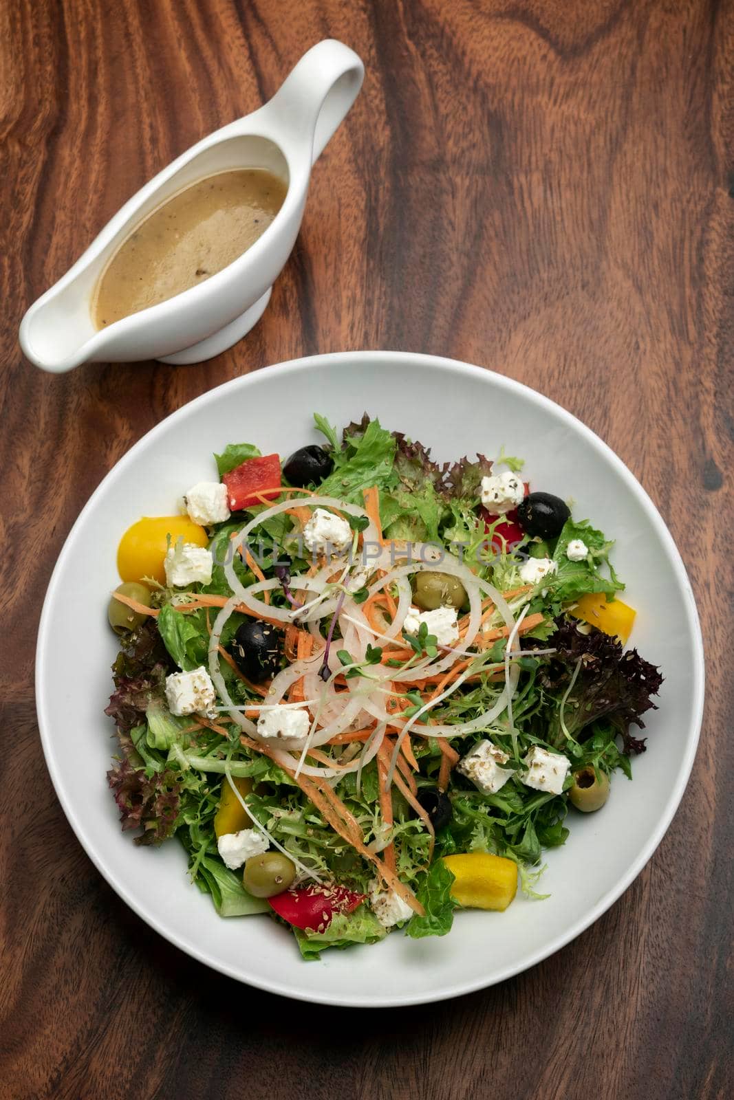 greek salad with feta cheese and olives with citrus vinaigrette by jackmalipan