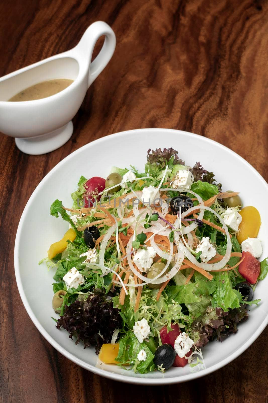 greek salad with feta cheese and olives with citrus vinaigrette by jackmalipan