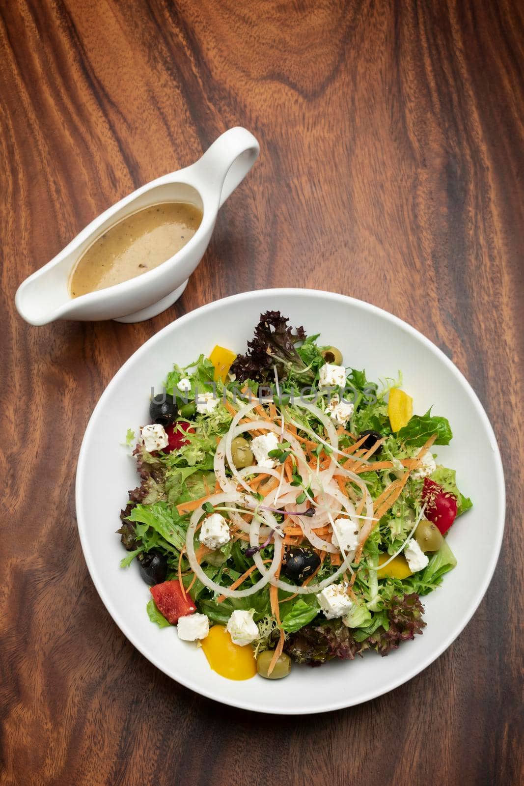 greek salad with feta cheese and olives with citrus vinaigrette by jackmalipan