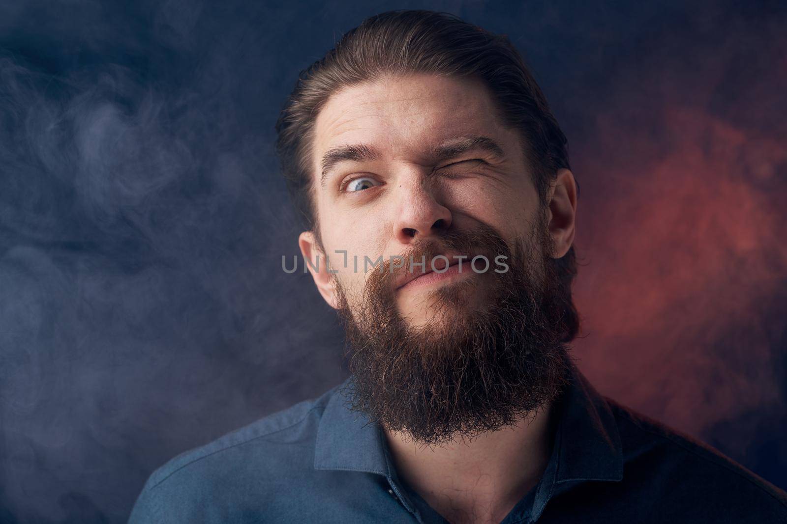 Cheerful man beard emotions black shirt close-up. High quality photo