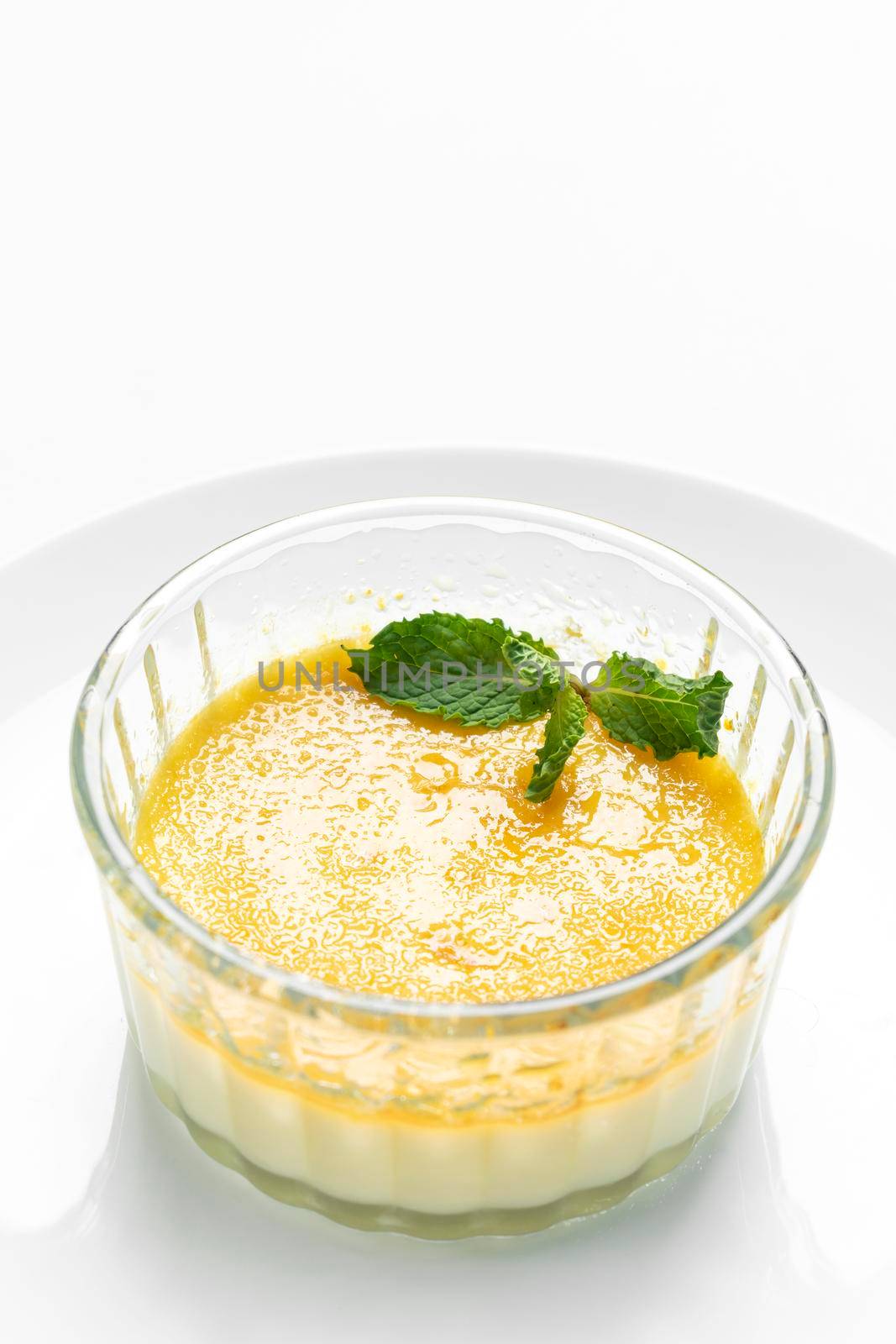 vegan dairy free organic coconut creme brulee on white background by jackmalipan