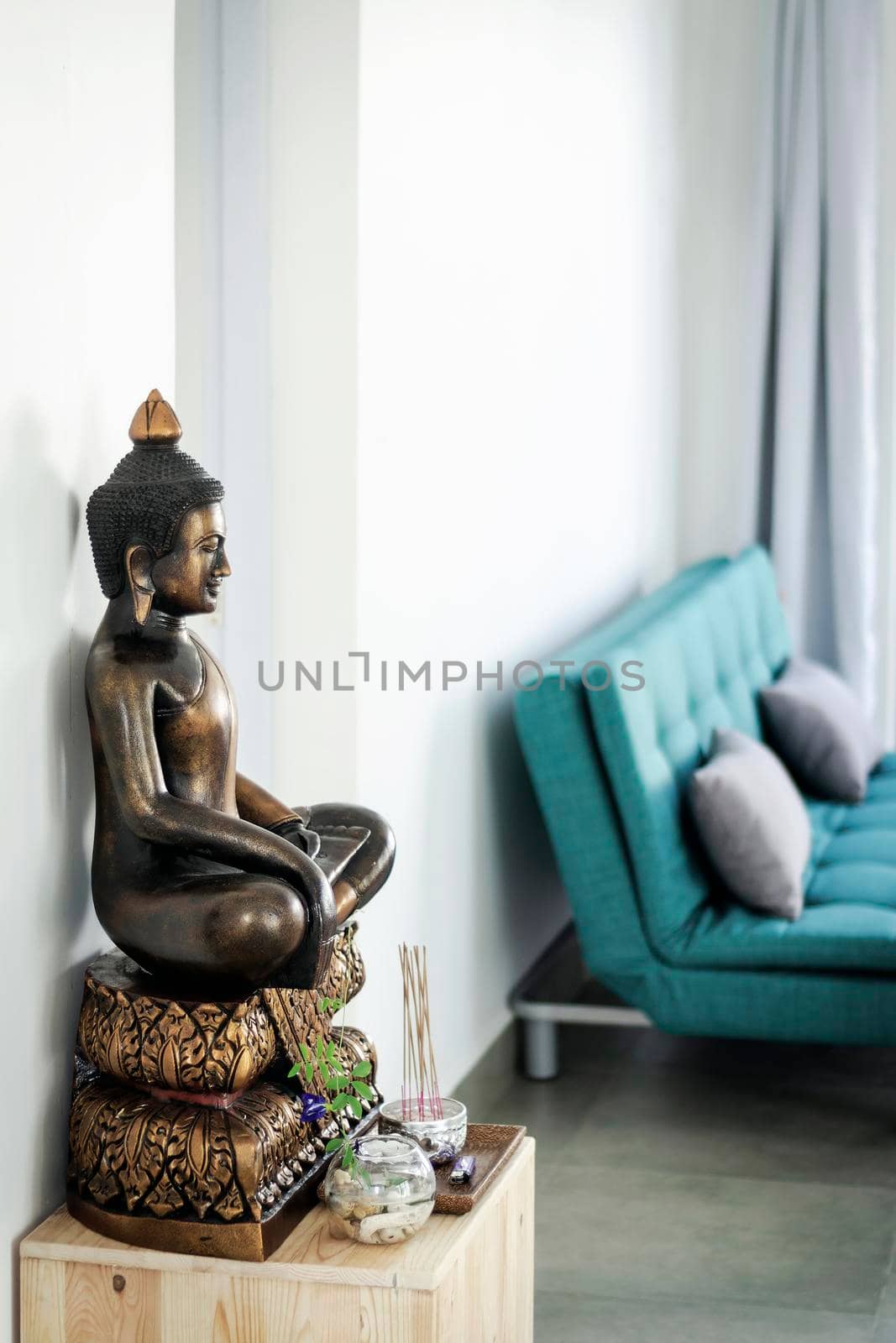 bronze buddha statue interior design detail in modern asian home by jackmalipan