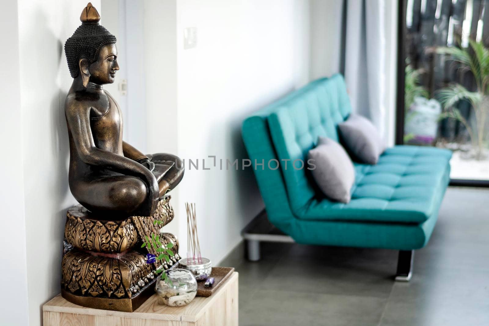 bronze buddha statue interior design detail in modern asian home by jackmalipan