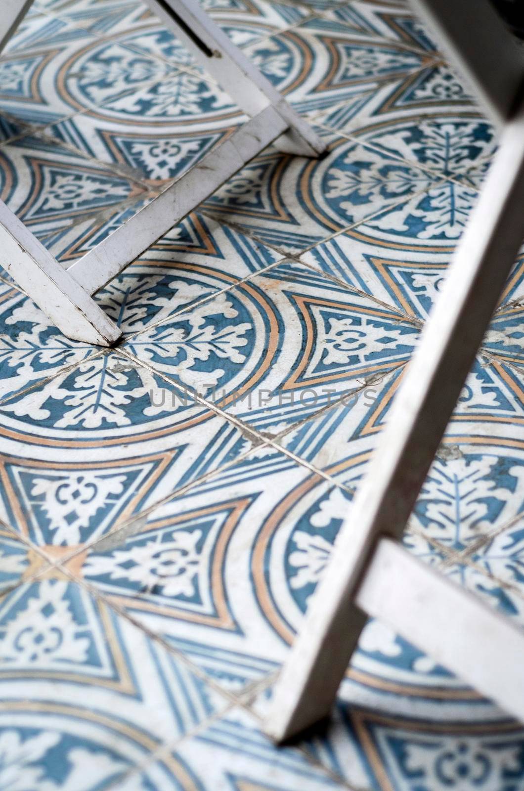 traditional design old rustic floor tiles detail in seville andalucia cafe