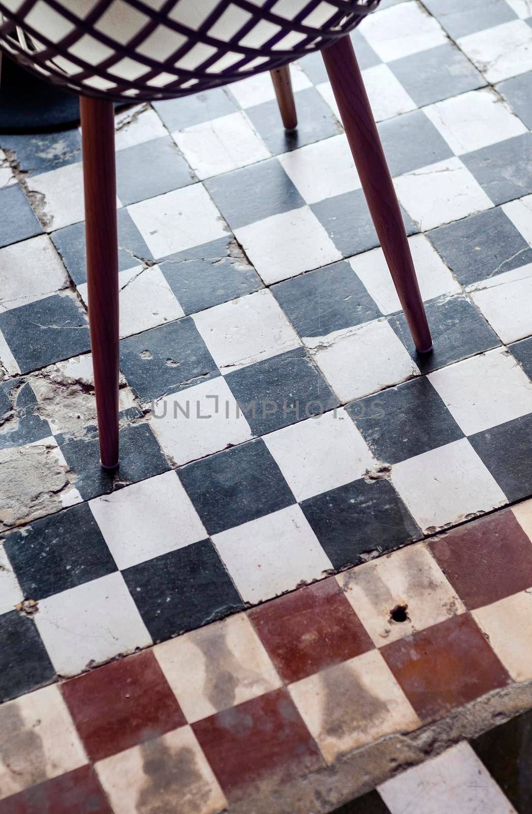 traditional design old rustic floor tiles detail in spanish cafe by jackmalipan