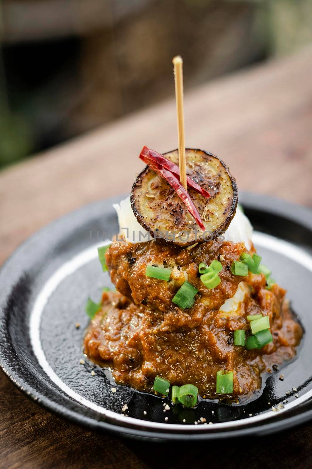 vegan quinoa cakes with sicilian roasted eggplant and spicy red pepper sauce gourmet tapas appetizer snack