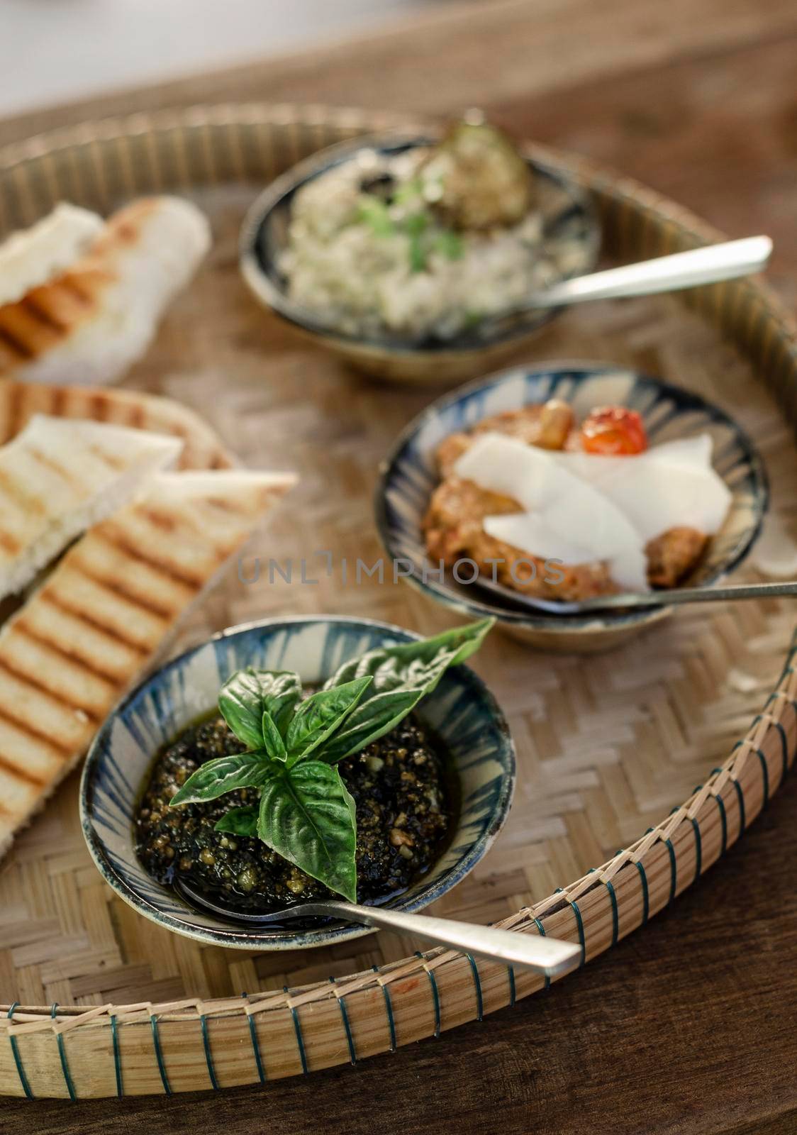 turkish meze vegetarian tapas snack platter on rustic wood table by jackmalipan