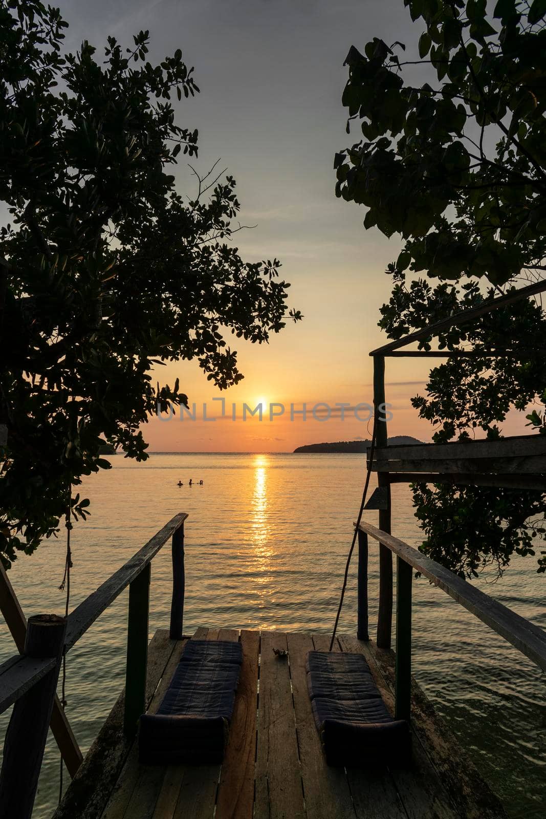 view from Koh Ta Kiev island in cambodia at sunset by jackmalipan