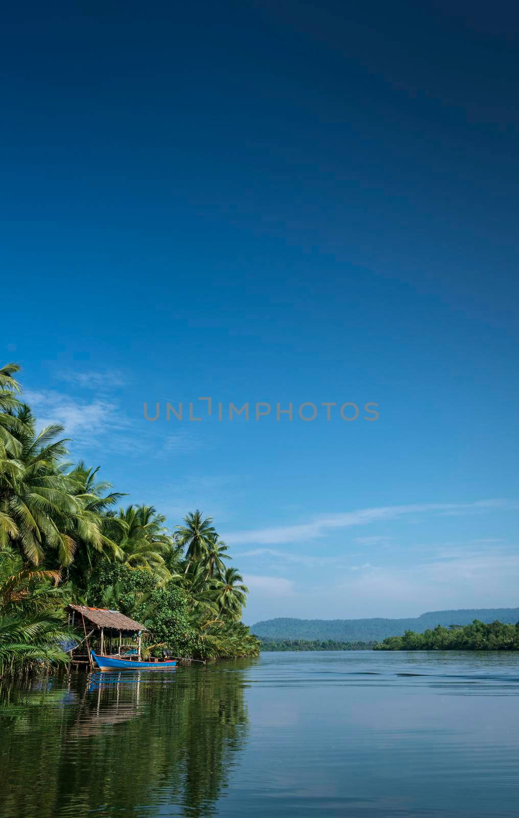 traditional boat and jungle hut on the tatai river in the cardamom mountains of cambodia