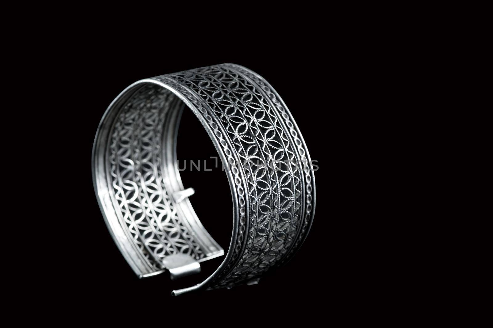 Vintage silver bracelet on black background