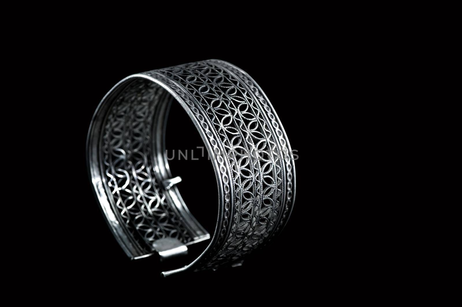 Vintage silver bracelet on black background