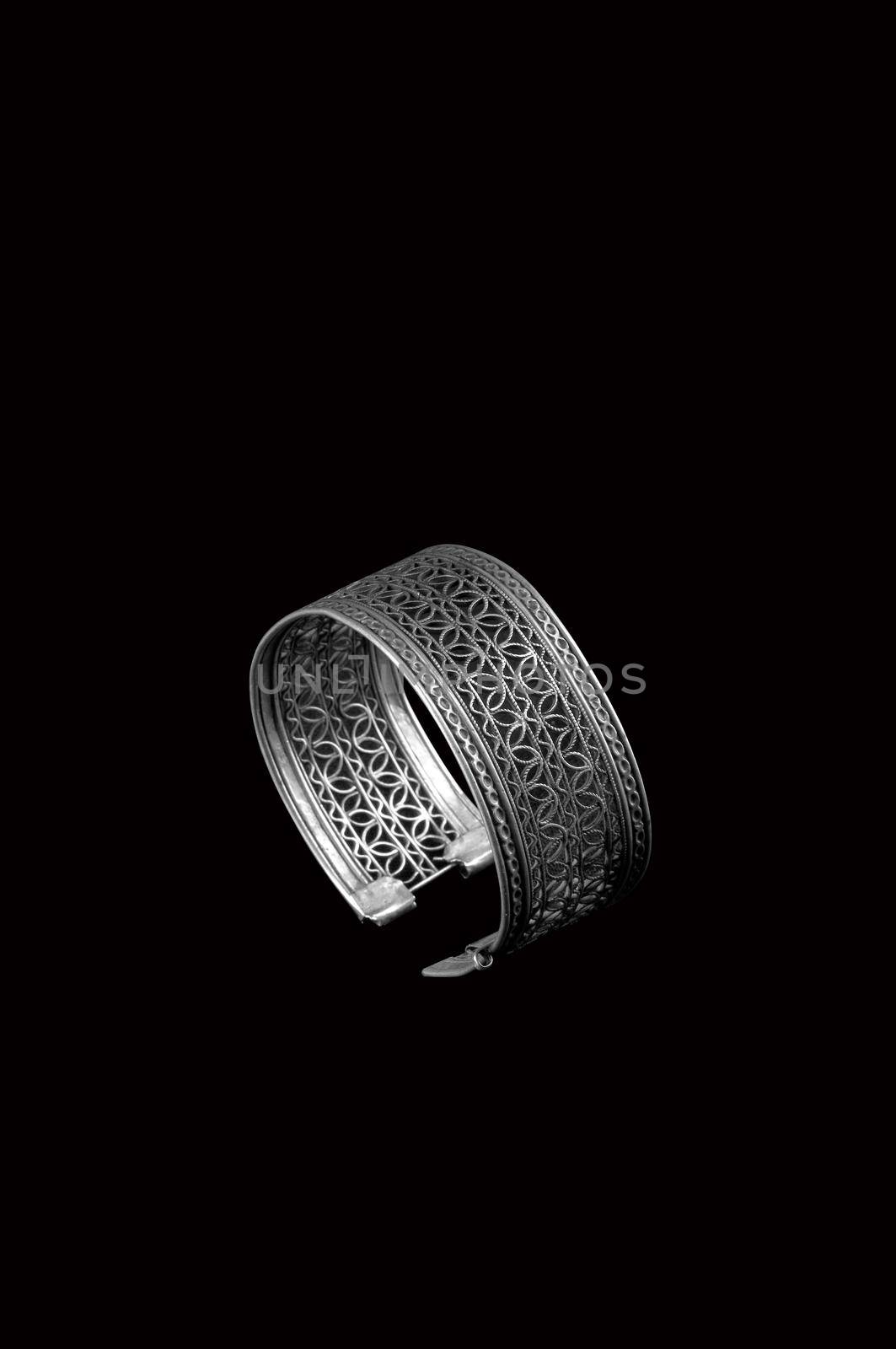 Vintage silver bracelet on black background