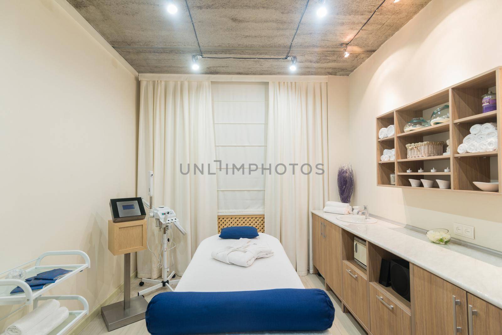 Interior of a modern massage room in a spa salon