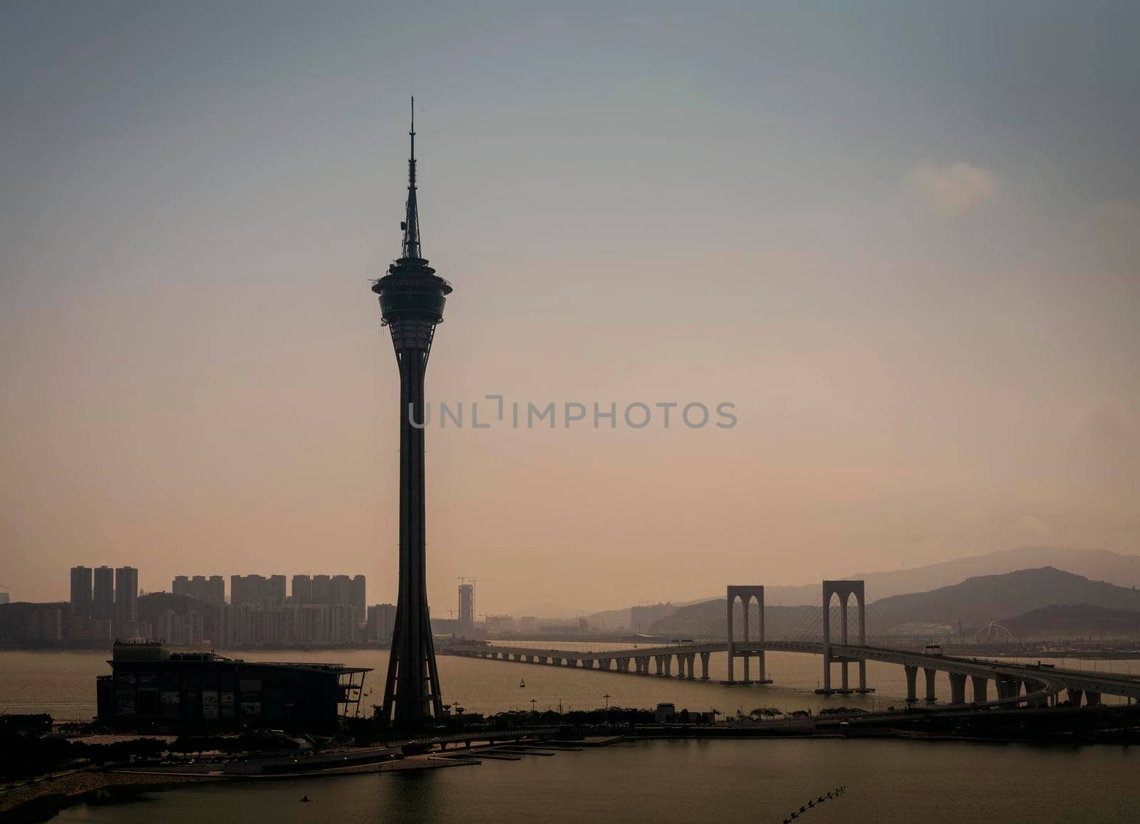 macau tower and taipa bridge area skyline view on foggy day in china